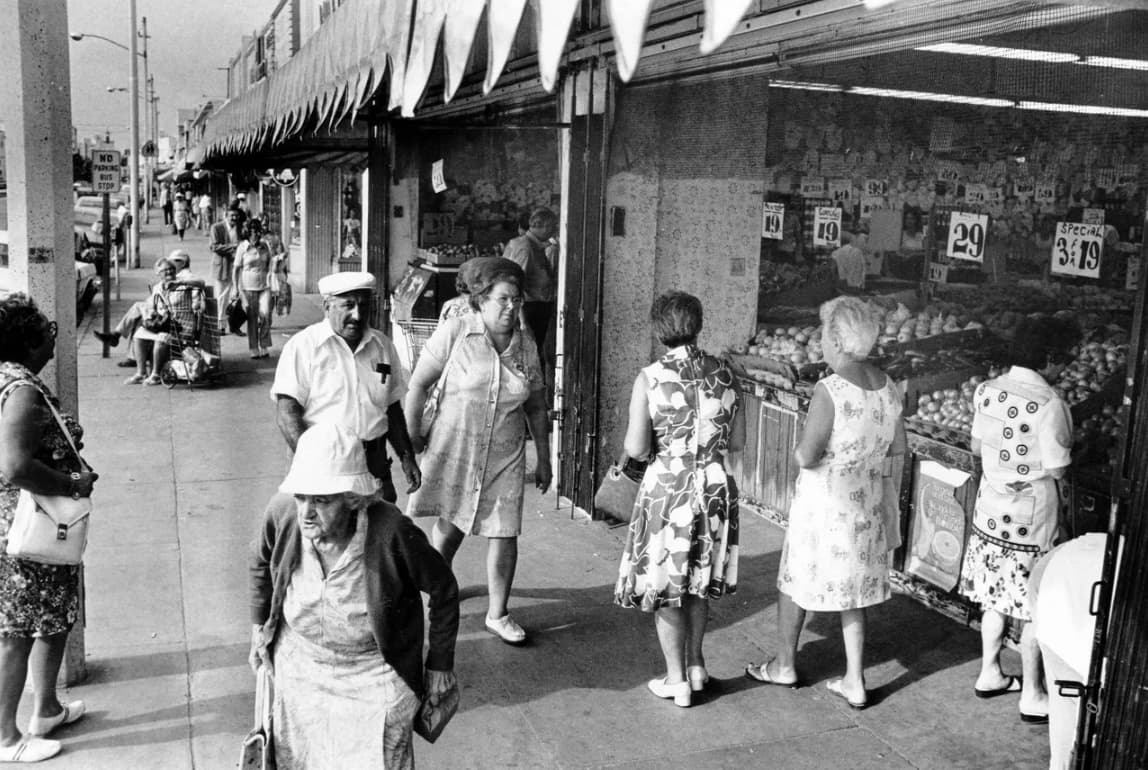 A bustling fruit market, date unknown. 